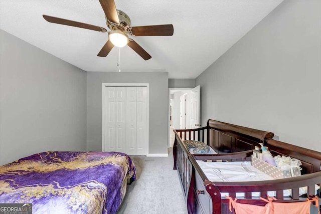 3190 Water Brook Dr SW, Conyers, GA 30094 - carpeted bedroom featuring a closet, ceiling fan, and baseboards