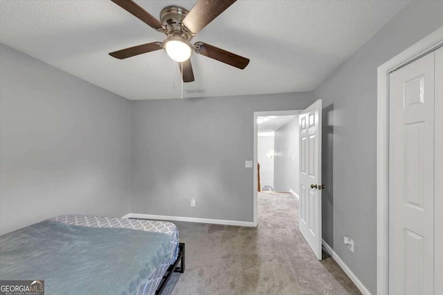 3190 Water Brook Dr SW, Conyers, GA 30094 - bedroom with carpet floors, baseboards, ceiling fan, and a textured ceiling