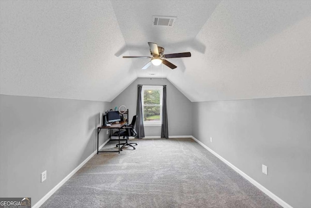 3190 Water Brook Dr SW, Conyers, GA 30094 - office area featuring a textured ceiling, ceiling fan, lofted ceiling, carpet floors, and baseboards