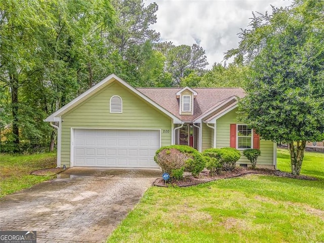 200 Wildwood, Calhoun, GA 30701 - view of front facade featuring driveway, a garage, a front yard, and roof with shingles