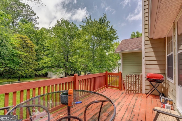 200 Wildwood, Calhoun, GA 30701 - wooden deck with outdoor dining area and a grill
