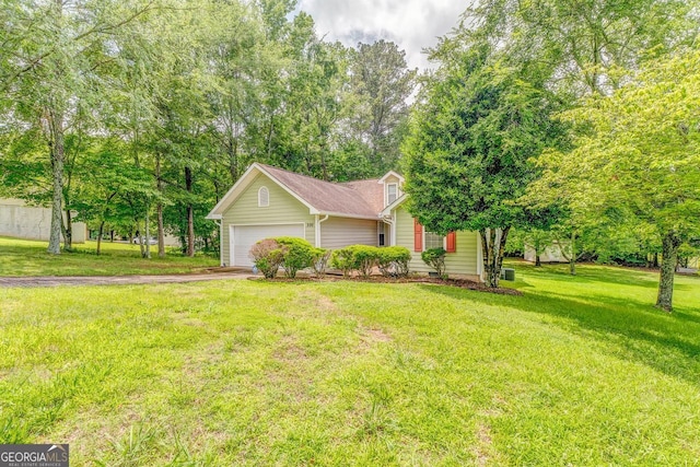 200 Wildwood, Calhoun, GA 30701 - view of front of home with driveway, a front lawn, and an attached garage