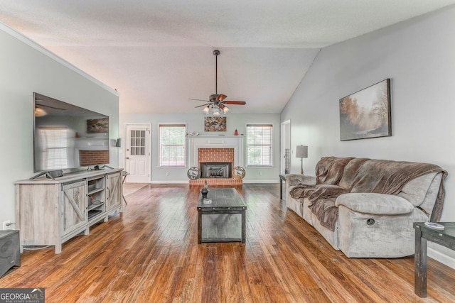 200 Wildwood, Calhoun, GA 30701 - living room featuring ceiling fan, wood finished floors, a fireplace, baseboards, and lofted ceiling