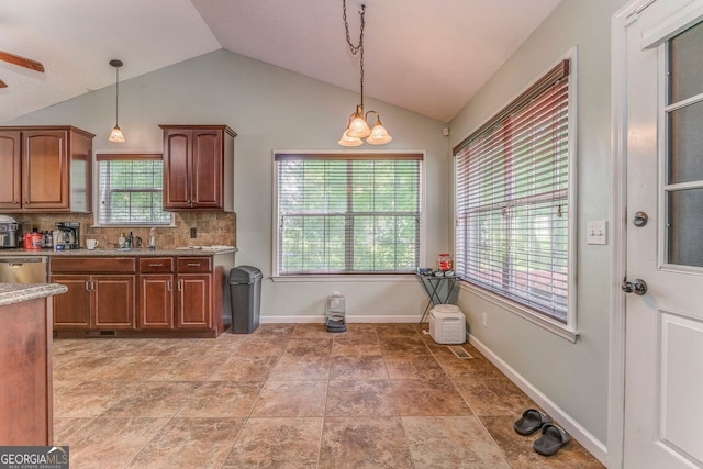 200 Wildwood, Calhoun, GA 30701 - kitchen featuring lofted ceiling, hanging light fixtures, stainless steel dishwasher, tasteful backsplash, and brown cabinets