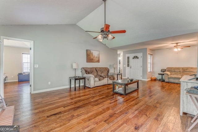 200 Wildwood, Calhoun, GA 30701 - living room with a ceiling fan, light wood-style flooring, baseboards, and high vaulted ceiling