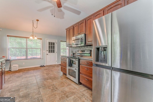 200 Wildwood, Calhoun, GA 30701 - kitchen with stainless steel appliances, a ceiling fan, baseboards, hanging light fixtures, and plenty of natural light