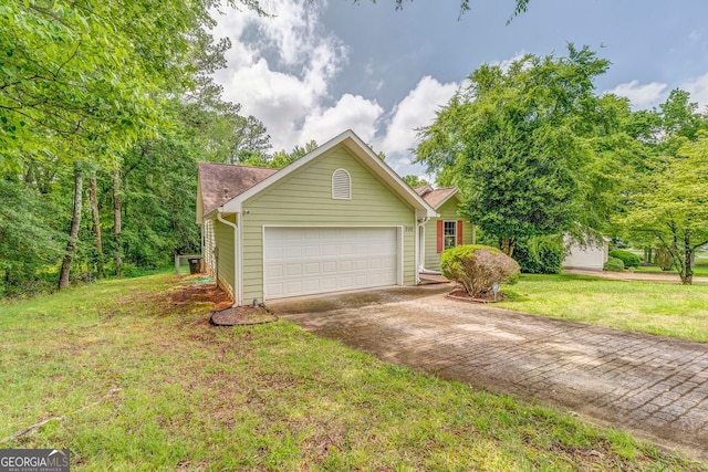 200 Wildwood, Calhoun, GA 30701 - view of front of house featuring driveway, a garage, and a front yard
