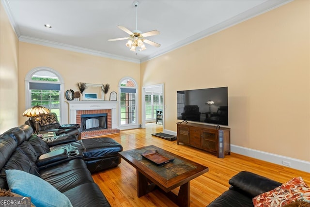 40 Costleys Bridge Dr, Oxford, GA 30054 - living room with crown molding, a ceiling fan, a fireplace, wood finished floors, and baseboards
