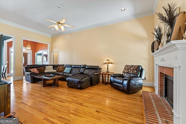 40 Costleys Bridge Dr, Oxford, GA 30054 - living room featuring light wood-type flooring, a ceiling fan, a fireplace, and ornamental molding