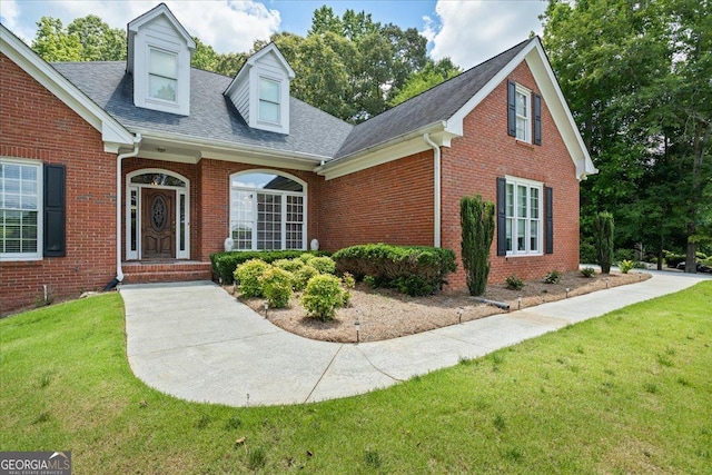40 Costleys Bridge Dr, Oxford, GA 30054 - view of front facade featuring brick siding, a front yard, and roof with shingles