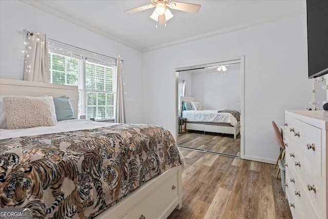 40 Costleys Bridge Dr, Oxford, GA 30054 - bedroom with crown molding, light wood-type flooring, a closet, and ceiling fan