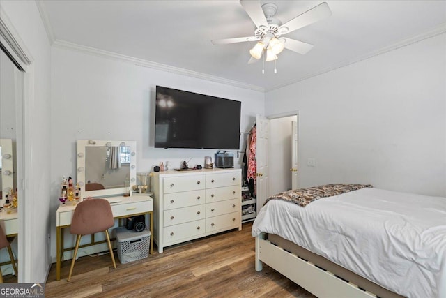 40 Costleys Bridge Dr, Oxford, GA 30054 - bedroom featuring crown molding, wood finished floors, ceiling fan, a desk, and a closet