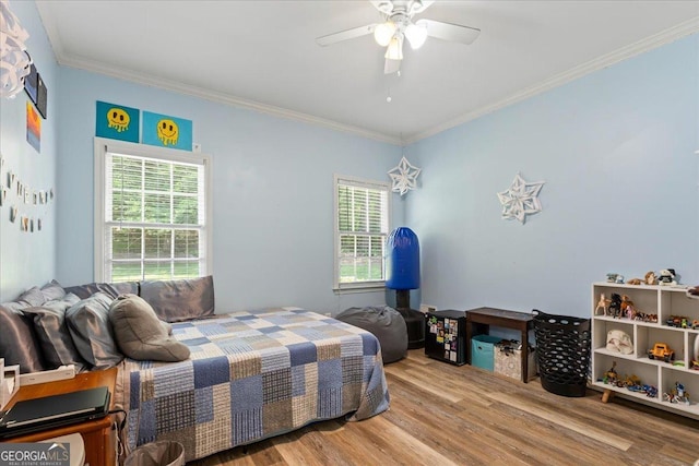 40 Costleys Bridge Dr, Oxford, GA 30054 - bedroom with wood finished floors, multiple windows, crown molding, and ceiling fan