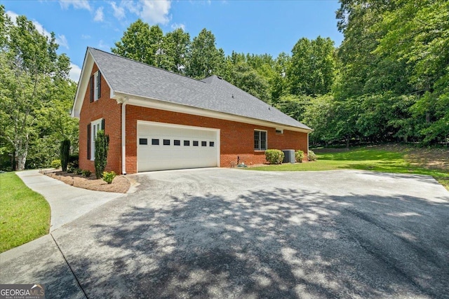 40 Costleys Bridge Dr, Oxford, GA 30054 - view of side of property featuring brick siding, concrete driveway, cooling unit, a yard, and roof with shingles