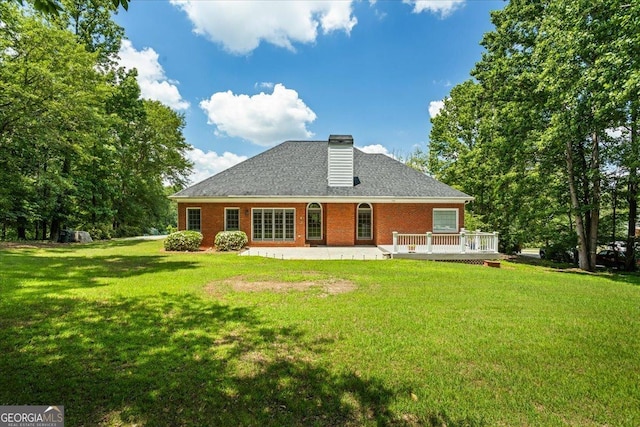 40 Costleys Bridge Dr, Oxford, GA 30054 - rear view of house with a lawn, brick siding, a chimney, a patio area, and roof with shingles