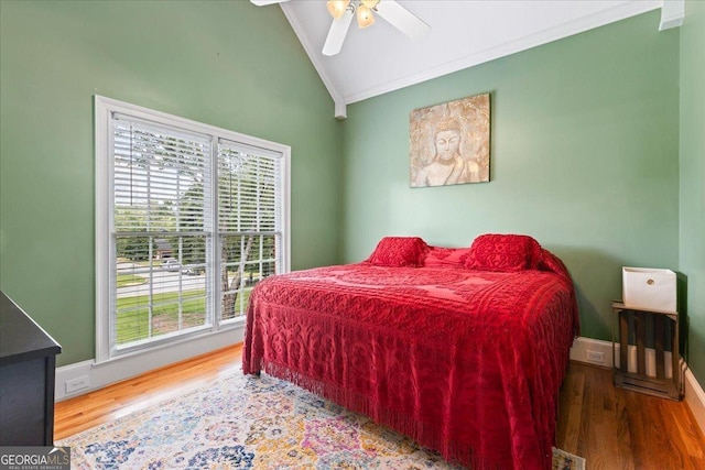 40 Costleys Bridge Dr, Oxford, GA 30054 - bedroom featuring lofted ceiling, crown molding, multiple windows, wood finished floors, and baseboards