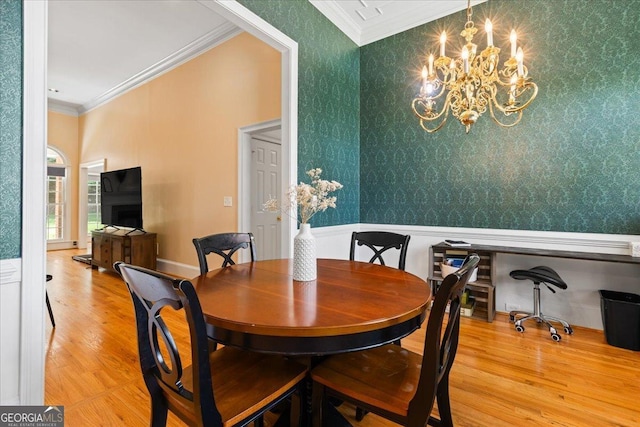 40 Costleys Bridge Dr, Oxford, GA 30054 - dining area with crown molding, a chandelier, wood finished floors, and wallpapered walls