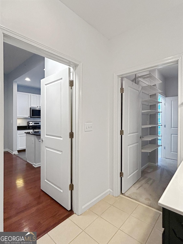 3040 Peachtree Rd Unit 1501, Atlanta, GA 30305 - hallway featuring baseboards and tile patterned floors
