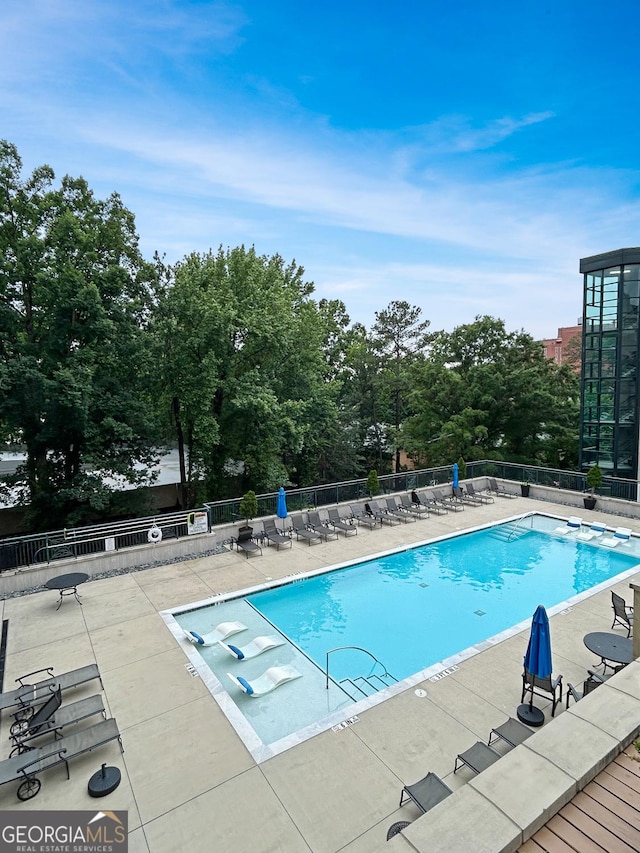 3040 Peachtree Rd Unit 1501, Atlanta, GA 30305 - community pool featuring a patio area