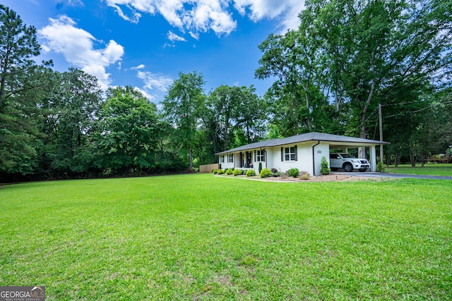 101 Crestwood Dr, Lagrange, GA 30241 - view of green lawn featuring an attached carport and driveway