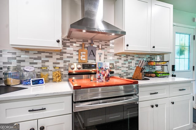 101 Crestwood Dr, Lagrange, GA 30241 - kitchen featuring wall chimney range hood, electric range, white cabinets, and tasteful backsplash