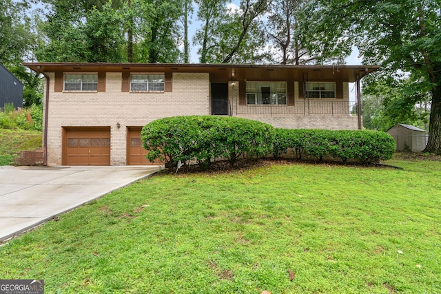 900 Fleetwood Cir SW, Atlanta, GA 30311 - view of front facade with a garage, concrete driveway, brick siding, and a front yard