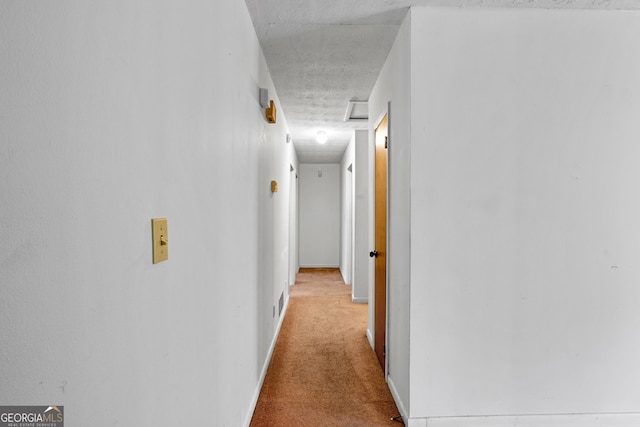 900 Fleetwood Cir SW, Atlanta, GA 30311 - hall with carpet flooring, attic access, a textured ceiling, and baseboards