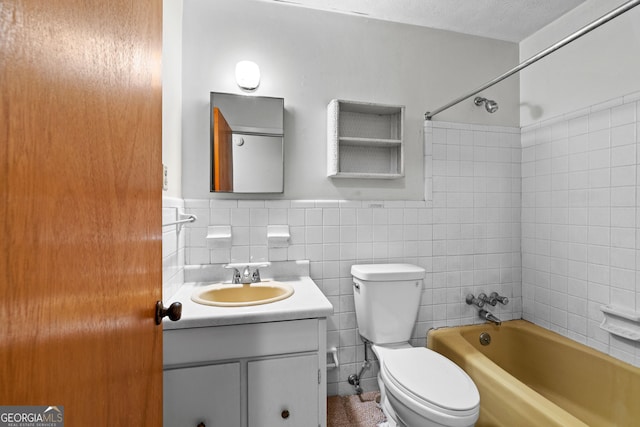 900 Fleetwood Cir SW, Atlanta, GA 30311 - full bathroom featuring toilet, vanity, bathing tub / shower combination, tile walls, and wainscoting