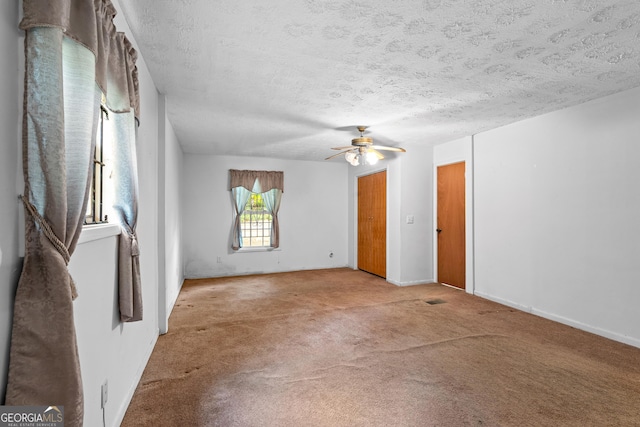 900 Fleetwood Cir SW, Atlanta, GA 30311 - empty room with a textured ceiling, carpet flooring, ceiling fan, and baseboards