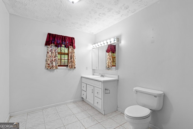 900 Fleetwood Cir SW, Atlanta, GA 30311 - bathroom featuring vanity, a textured ceiling, toilet, baseboards, and marble finish flooring