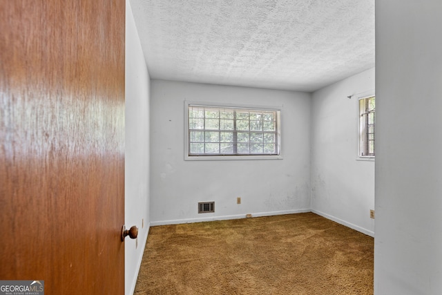 900 Fleetwood Cir SW, Atlanta, GA 30311 - spare room with carpet, a textured ceiling, and baseboards