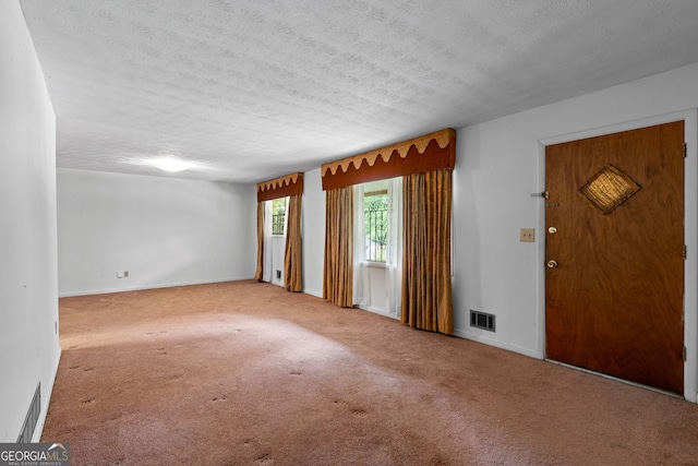 900 Fleetwood Cir SW, Atlanta, GA 30311 - carpeted foyer entrance featuring a textured ceiling and baseboards