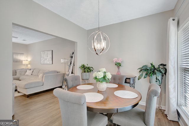 17 Roxbury Ln, Newnan, GA 30265 - dining space featuring light wood-style flooring, a chandelier, healthy amount of natural light, and baseboards