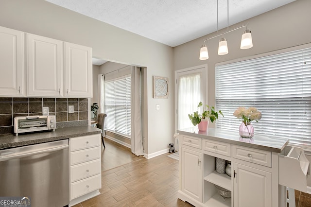 17 Roxbury Ln, Newnan, GA 30265 - kitchen with dishwasher, baseboards, light wood finished floors, and white cabinetry