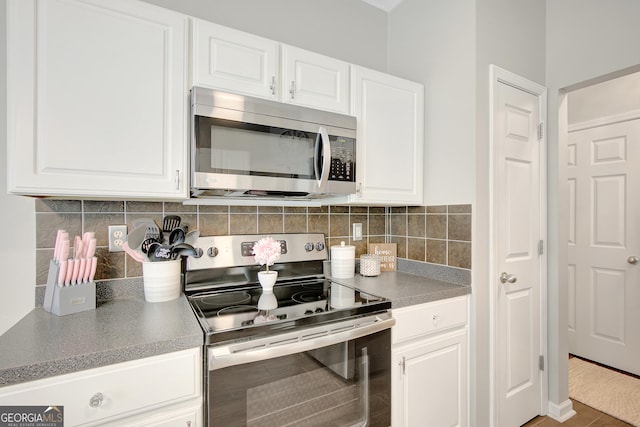 17 Roxbury Ln, Newnan, GA 30265 - kitchen featuring appliances with stainless steel finishes, white cabinets, and decorative backsplash