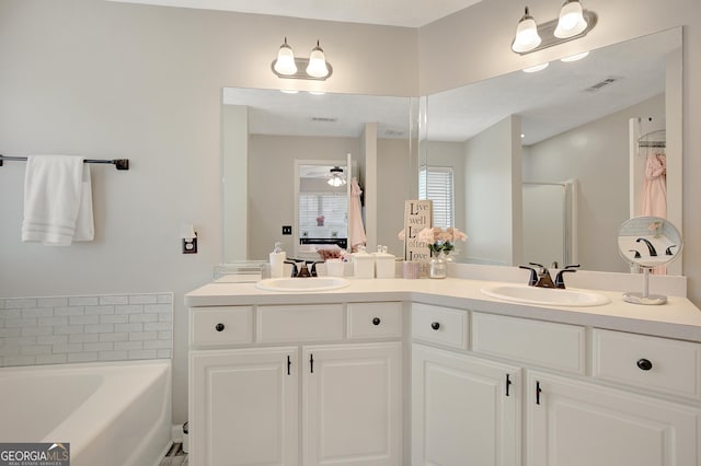 17 Roxbury Ln, Newnan, GA 30265 - ensuite bathroom featuring double vanity, a bath, and ceiling fan