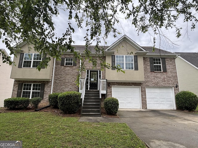4069 Savannah Ridge Ct, Loganville, GA 30052 - raised ranch featuring brick siding, driveway, a garage, a front yard, and stucco siding