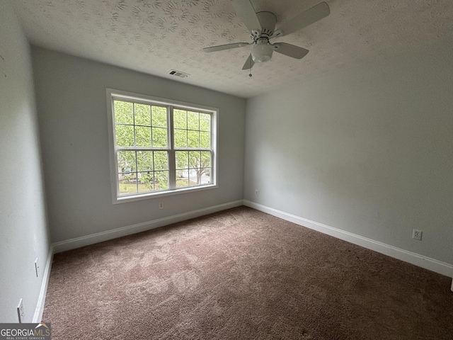 4069 Savannah Ridge Ct, Loganville, GA 30052 - carpeted empty room with a textured ceiling, baseboards, and a ceiling fan