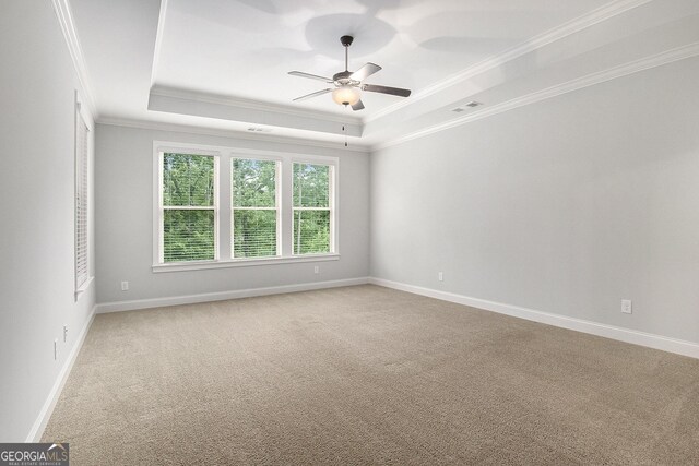7139 Lake Edge Dr, Flowery Branch, GA 30542 - empty room with crown molding, a tray ceiling, carpet flooring, and ceiling fan