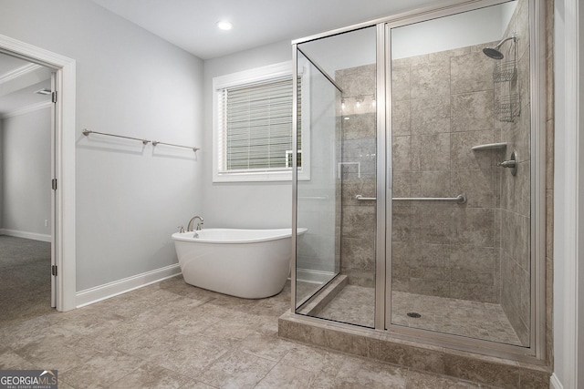 7139 Lake Edge Dr, Flowery Branch, GA 30542 - bathroom with a soaking tub, a stall shower, and recessed lighting