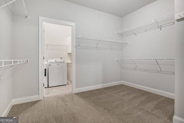 7139 Lake Edge Dr, Flowery Branch, GA 30542 - walk in closet with washing machine and dryer and light colored carpet