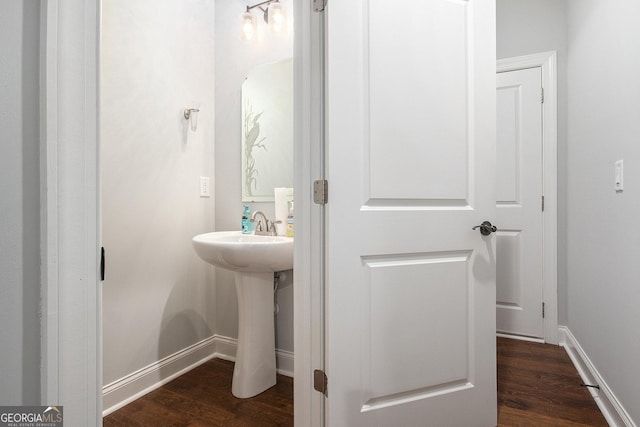 7139 Lake Edge Dr, Flowery Branch, GA 30542 - bathroom featuring wood finished floors and baseboards