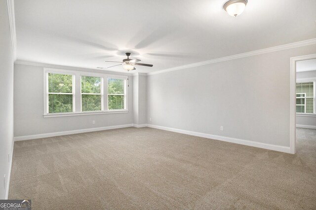 7139 Lake Edge Dr, Flowery Branch, GA 30542 - carpeted spare room featuring a ceiling fan and crown molding