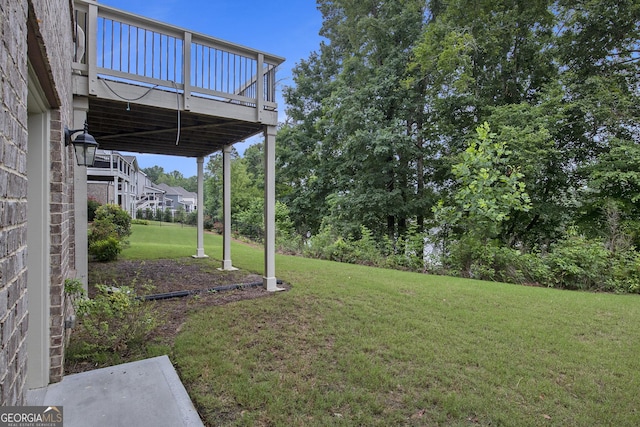 7139 Lake Edge Dr, Flowery Branch, GA 30542 - view of green lawn with stairs and a wooden deck