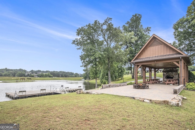 7139 Lake Edge Dr, Flowery Branch, GA 30542 - view of green lawn featuring a water view, a floating dock, a gazebo, and a patio
