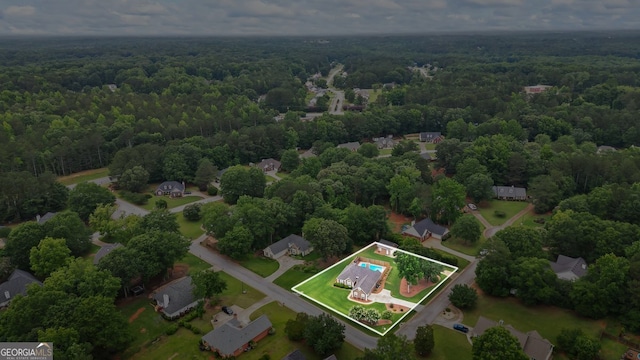 15 Livingston Way, Covington, GA 30016 - aerial overview of property's location featuring a heavily wooded area and property boundaries highlighted