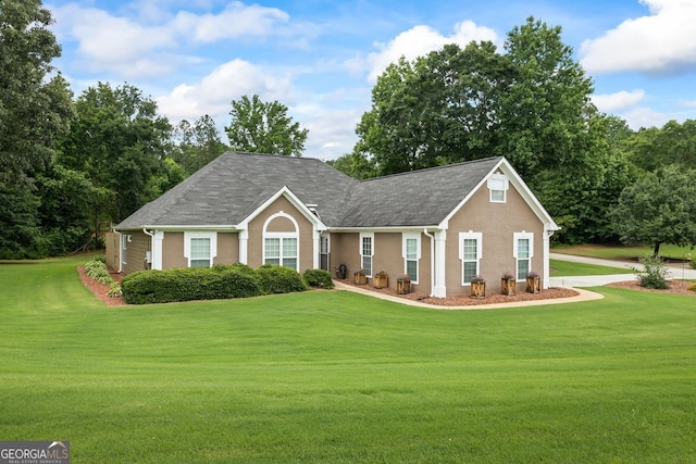 15 Livingston Way, Covington, GA 30016 - view of front facade with a front lawn, stucco siding, and roof with shingles