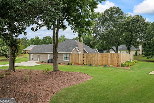 15 Livingston Way, Covington, GA 30016 - view of front of property with cooling unit and a chimney