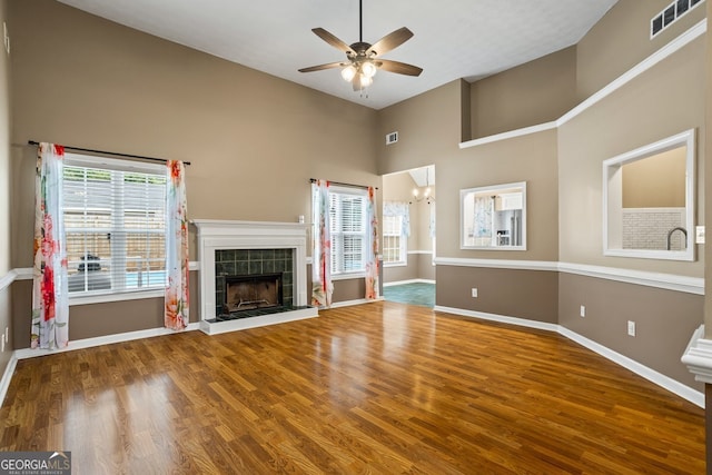 15 Livingston Way, Covington, GA 30016 - unfurnished living room with a ceiling fan, high vaulted ceiling, baseboards, and wood finished floors