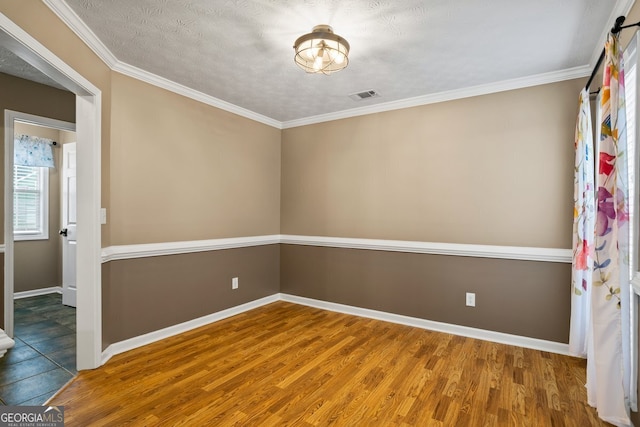 15 Livingston Way, Covington, GA 30016 - unfurnished room with wood finished floors, baseboards, and crown molding